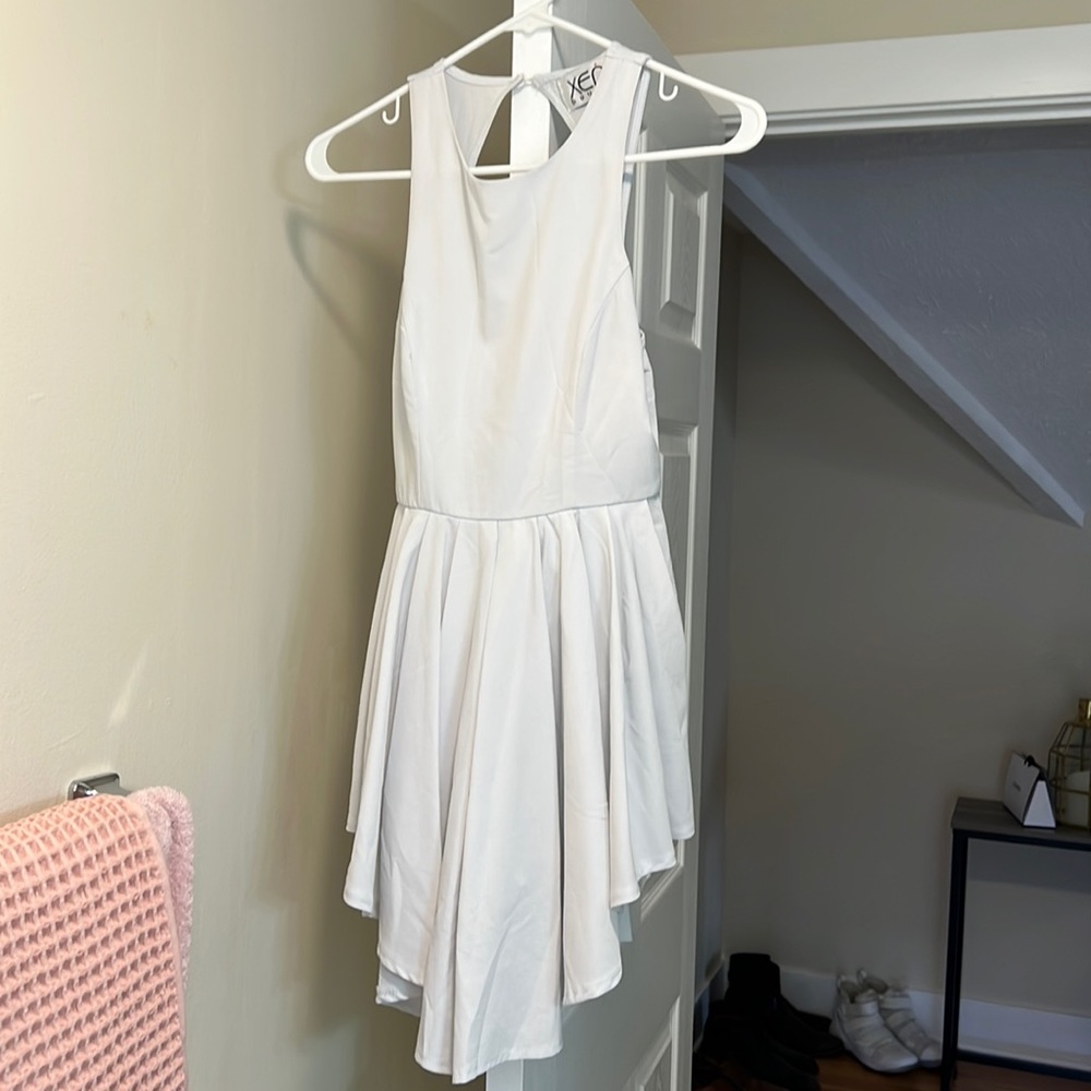 This is a white romper dress
